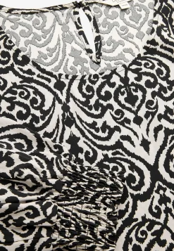 Bluse med smock ved manchetterne