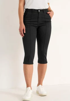 Elastiske crop jeans med syet pressefold