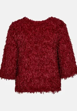 Festtop med fjerlignende materiale