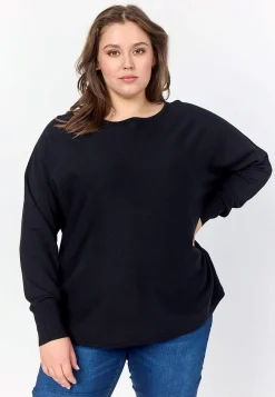 Fintstrikket trøje med knapper i ryggen