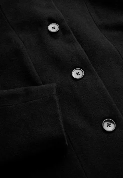 Frakke med opretstående krave