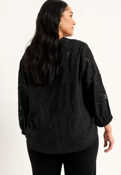 Jacquardvævet, næsten gennemsigtig bluse