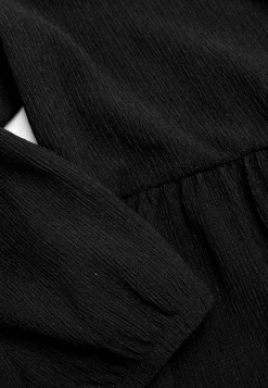 Jerseykjole med strukturmønster