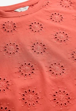 Jerseytop med broderet hulmønster