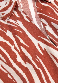 Langærmet, vævet tunika