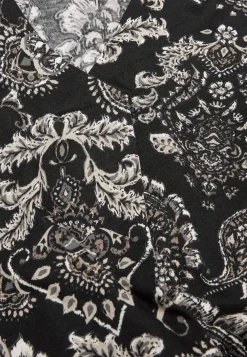 Mønstret jerseytunika med dekorativt læg