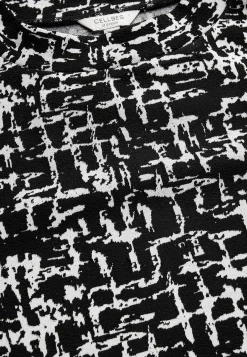 Mønstret kjole med sidelommer