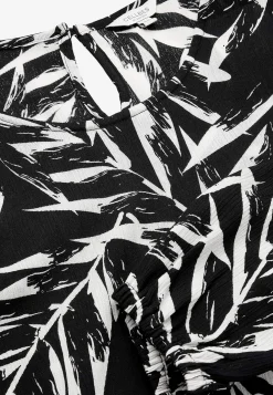 Tunika med strukturvævet stof