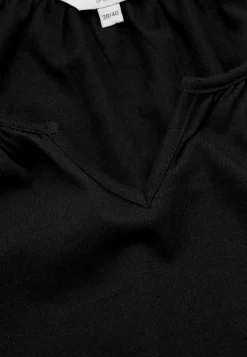 Tunika med volant nederst