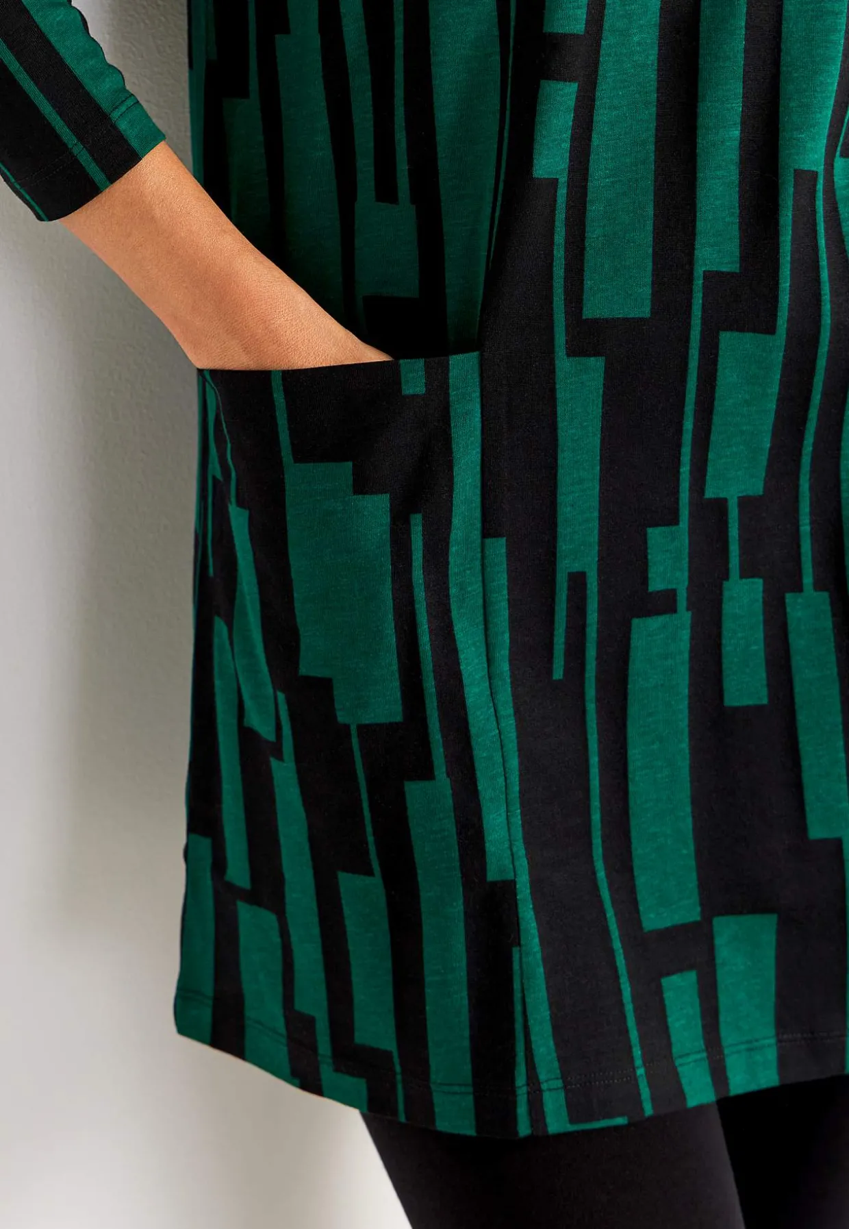 V-udskåret jerseytunika med lommer