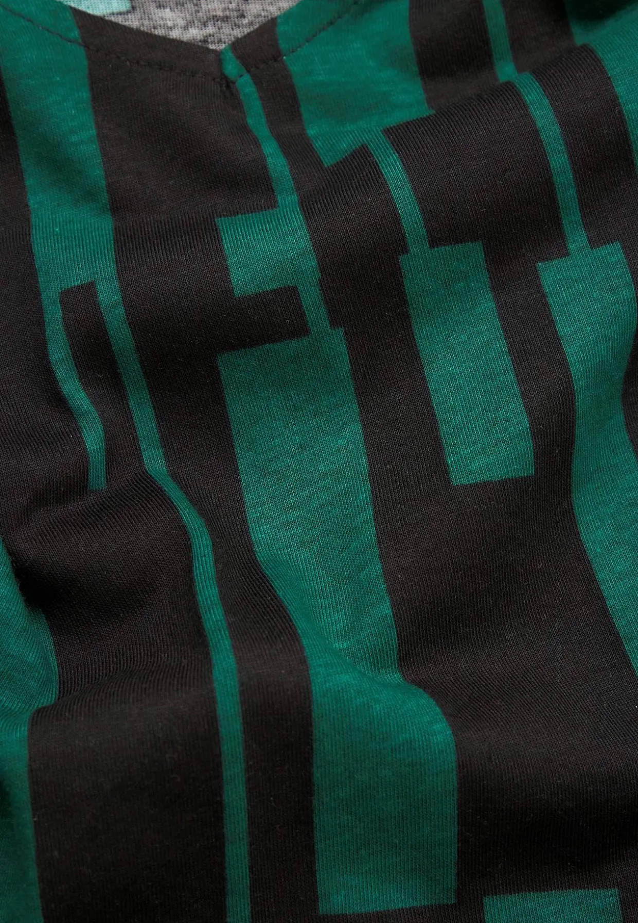 V-udskåret jerseytunika med lommer